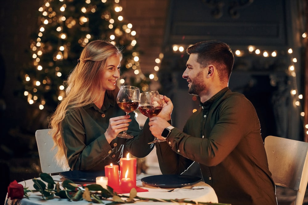 a happy couple is sitting in a luxury restaurant and having lunch, sugar daddy got a present