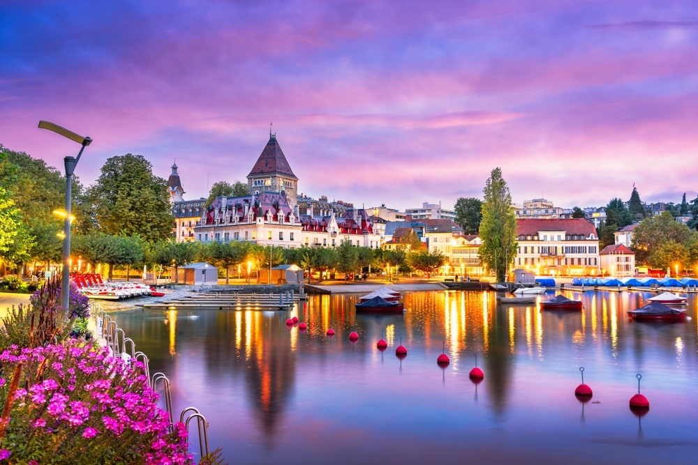 Switzerland from the Ouchy Promenade on Lake Leman at twilight.