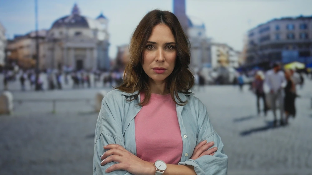 Confident young woman standing with arms crossed, symbolizing authenticity and self-assurance